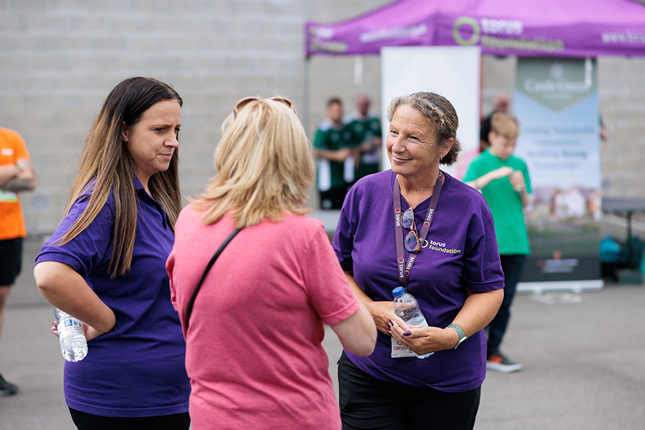 Photo of people talking at the FireFit Hub Retro Sports Day 2023