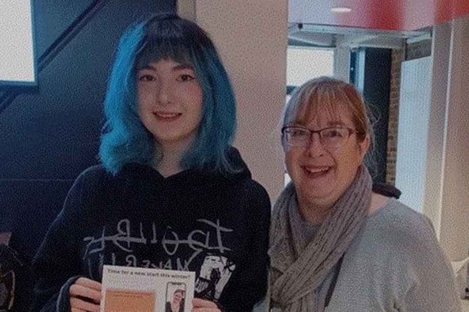 Photo of two people stood facing the camera